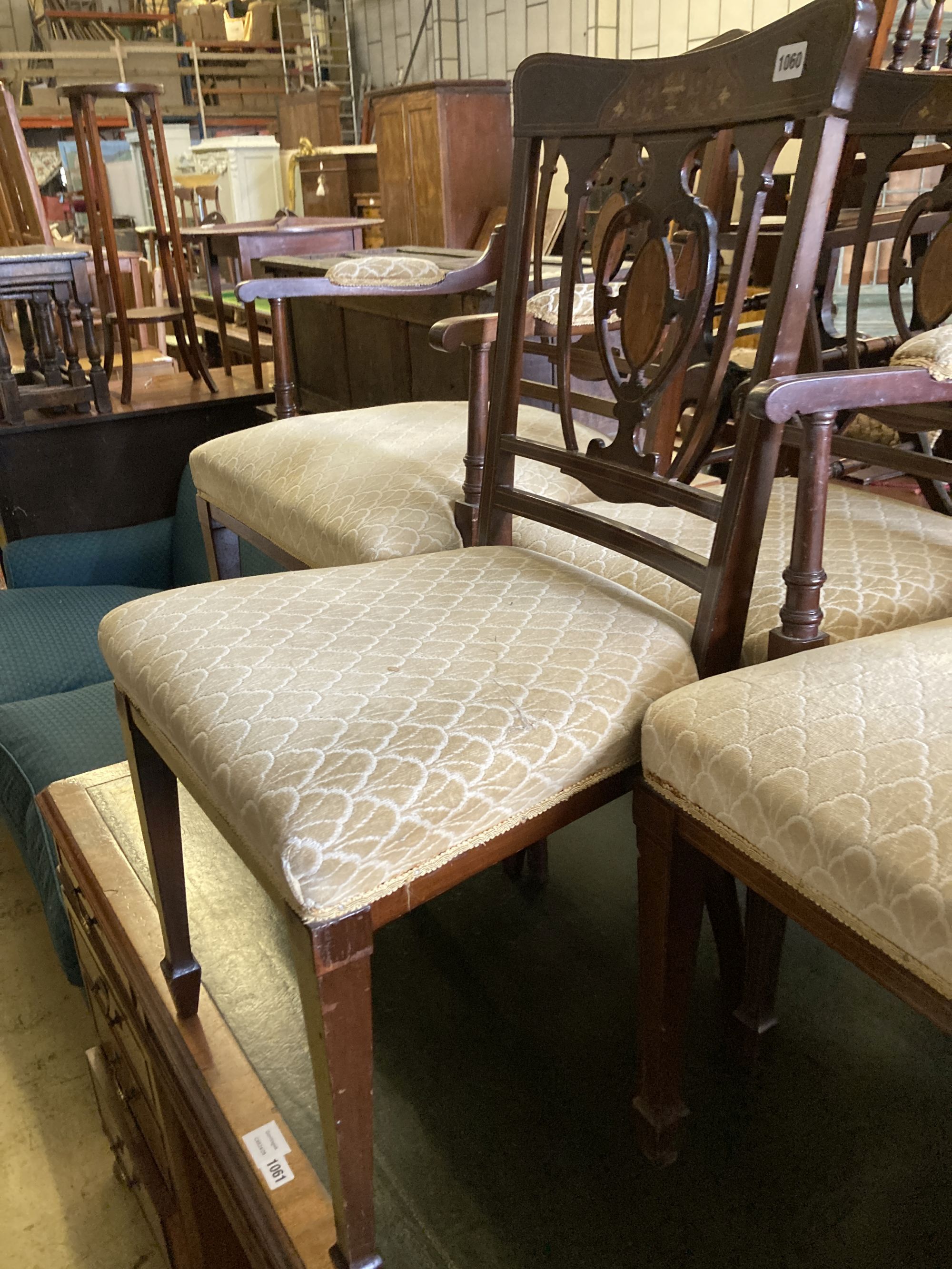 A pair of Edwardian inlaid mahogany elbow chairs and a matching single chair (3)